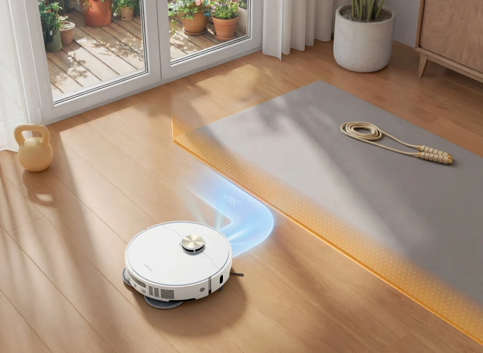 Robotas apvažiuoja kilimą